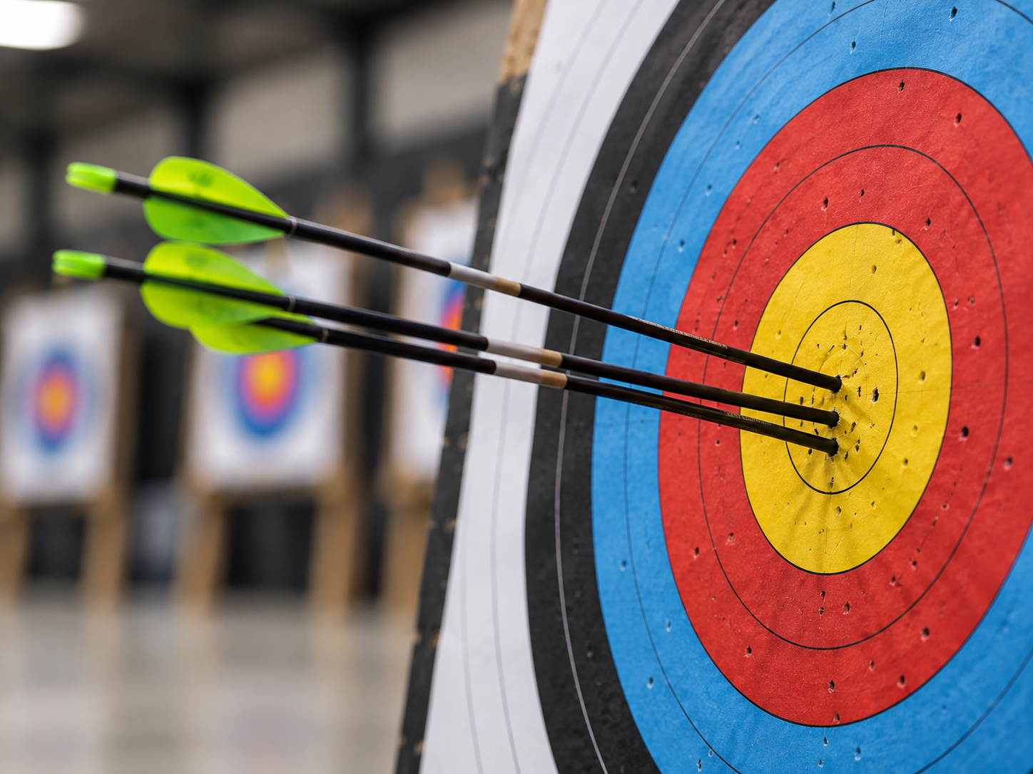 A young archer working through their pre-shot routine on the range.