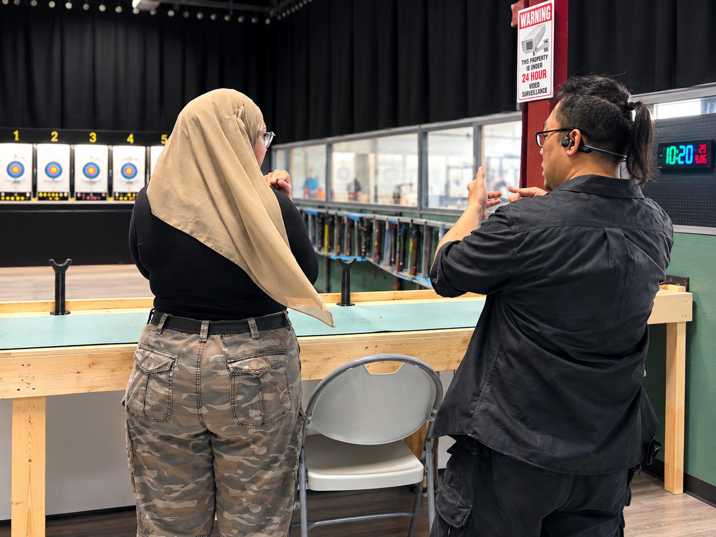 One-on-one airgun coaching during a session at OnPoint Archery